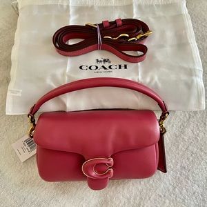 Coach, Pillow Tabby 18; color Rouge, new, never used, pet free/smoke free home.